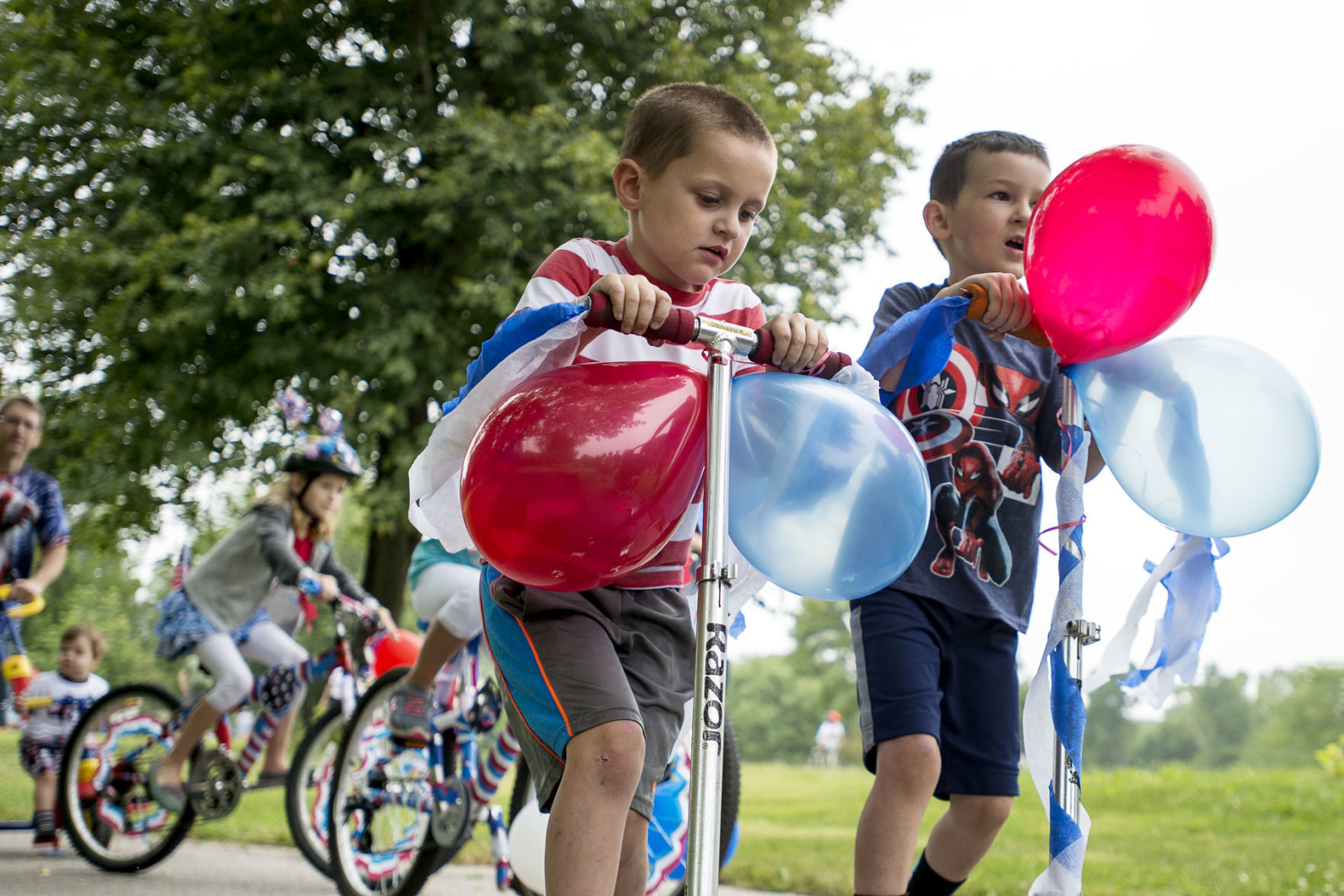 Kids on scooters at July 4 celebration, 2016